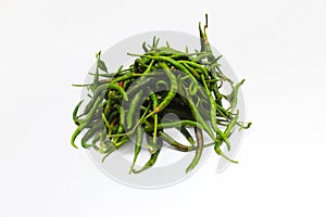 a bunch of fresh curly green chilies (Cabai Merah Keriting) isolated on white background.