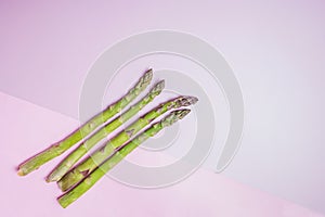 Bunch of fresh green asparagus spears on a rustic wooden table