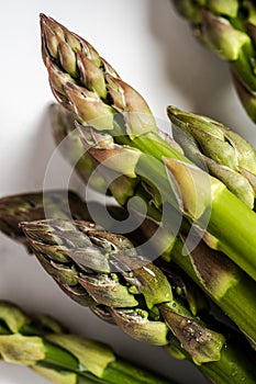 Bunch of fresh green asparagus tips macro closeup