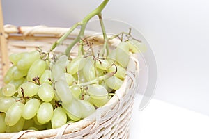 A bunch of fresh green grape in bucket.