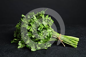 Bunch of fresh green parsley on table