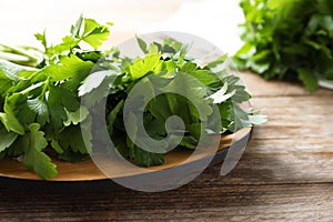 Bunch of fresh green parsley on table, closeup