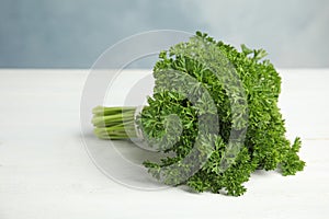 Bunch of fresh green parsley on wooden table