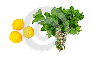 Bunch of fresh mint and three lemons