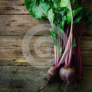 Bunch of fresh organic beetroot on wooden background. Concept of diet, raw, vegetarian meal. Farm, rustic and country