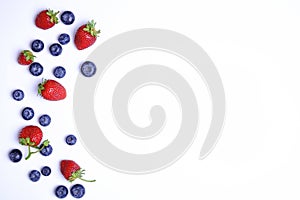 Bunch of fresh organic mixed berries, blueberry & strawberry in seamless pattern, white background. Clean eating concept. Healthy