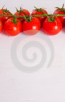 Bunch of fresh organic tomatoes isolated on white background