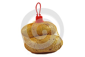 Bunch fresh potatoes in a orange mesh bag