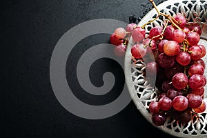Bunch of fresh red grapes on a tray