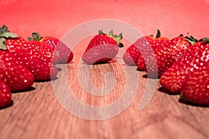 Bunch of fresh red strawberries drying on a wooden surface with copy space