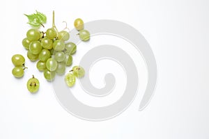 Bunch of fresh ripe green grapes with leaf on white background, top view