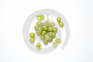 Bunch of fresh ripe green grapes with leaf on white background, top view