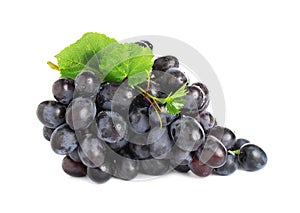 Bunch of fresh ripe juicy dark blue grapes with leaves isolated on white