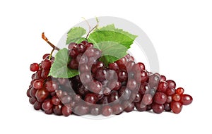 Bunch of fresh ripe juicy red grapes with leaves isolated on white