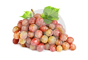 Bunch of fresh ripening red grapes with leaves isolated on white