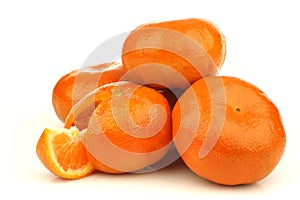 Bunch of fresh tangerines and a cut one