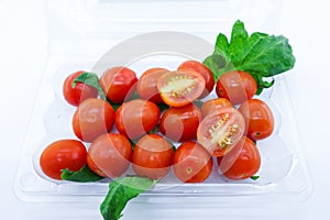 Bunch of fresh tomatoes with stem and leaves