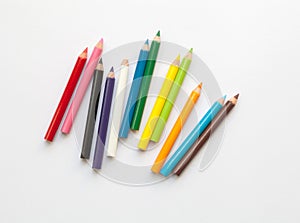 Bunch of fun mini colored pencils isolated on white. Multicolor group of wooden pencils photo