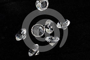 a bunch of glass stones in the form of diamonds on a black background