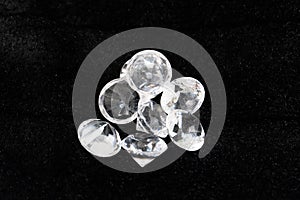 a bunch of glass stones in the form of diamonds on a black background