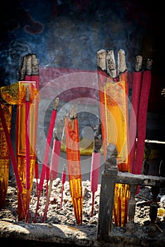 A bunch of glowing incense sticks