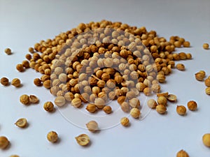 A bunch of goldy brown coriander isolated on white background