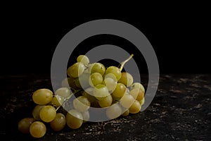 Bunch of grapes on black background