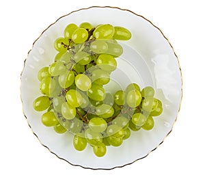 Bunch of grapes in plate isolated on white background