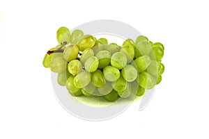 Bunch of grapes and raisins on a white background. Wine grapes, table grapes. Fresh fruit