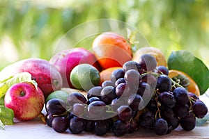 bunch of grapes and variety fruits