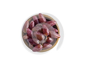 Bunch of grapes on a wooden bowl, top view. Grapes isolated on white background. Purple grapes with copy space for text.