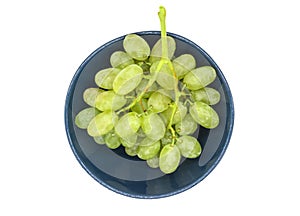 Bunch of green grapes in a plate isolated on white background