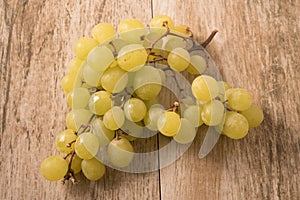 Bunch green grapes on wooden background