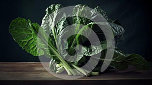 Bunch of green silverbeat vegetable leaves on wooden bench