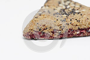 Bunch of integral fruit biscuits with cherries isolated on white background. Healthy food, copy space. Integral biscuit isolated