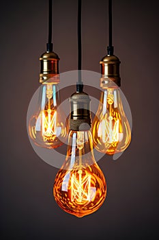 A bunch of isolated Vintage light bulbs hanging from a ceiling.