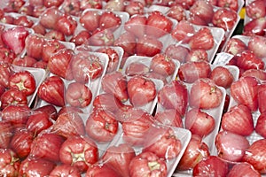 A bunch of juicy pink and red water apples