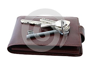 Bunch of keys on brown leather wallet