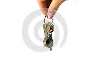 Bunch of keys in hand closeup isolated on white background