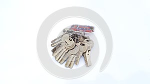 Bunch of keys on key ring arrangement isolated on white background