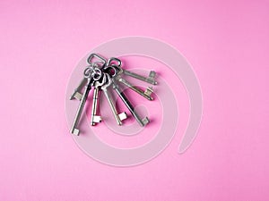 Bunch of keys on pink background