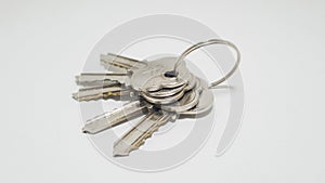 A bunch of keys on a white background. metal keys. door key