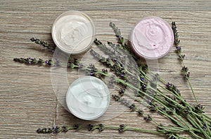 A bunch of lavender displayed with containers of body lotion photo