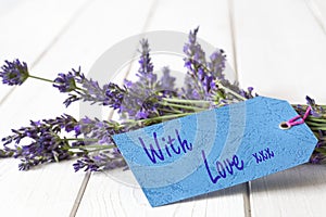 Bunch of lavender flowers,  with love and kisses written on a gift tag label