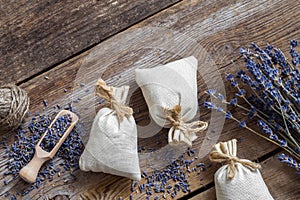 Bunch of lavender flowers and sachets filled with dried lavender