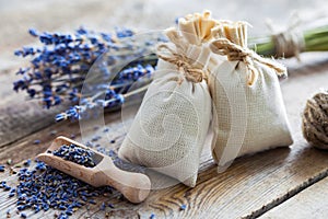 Bunch of lavender flowers and sachets filled with dried lavender