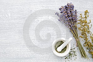 Bunch of lavender, healing herbs and mortar