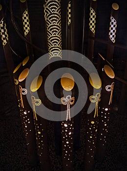 A bunch of lights that are in the dirt, photograph of enchanted garden. Beautiful picture of of lights that are on a pole.