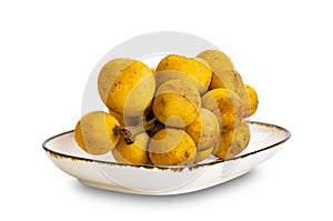 Bunch of Long Kong, Longkong, Langsart in brown ceramic tray photo