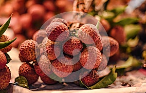 A bunch of lychee bunches are sold seasonally in a common fresh market